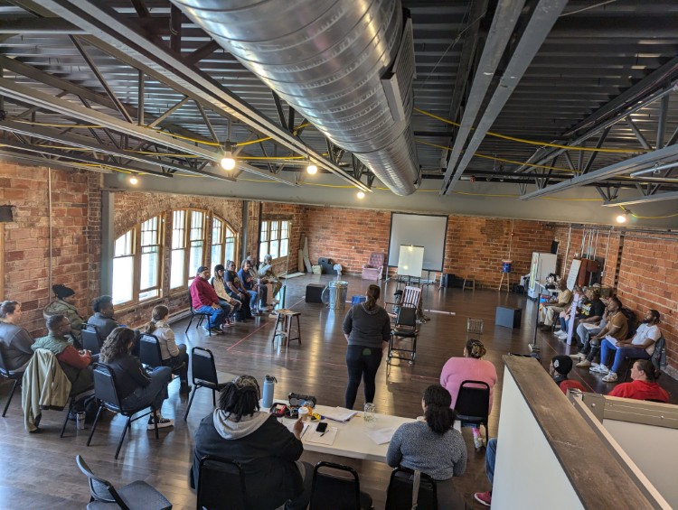 A small audience gathers to view rehearsals for Y-Haven Theatre Project's"Roots Through Ruin."